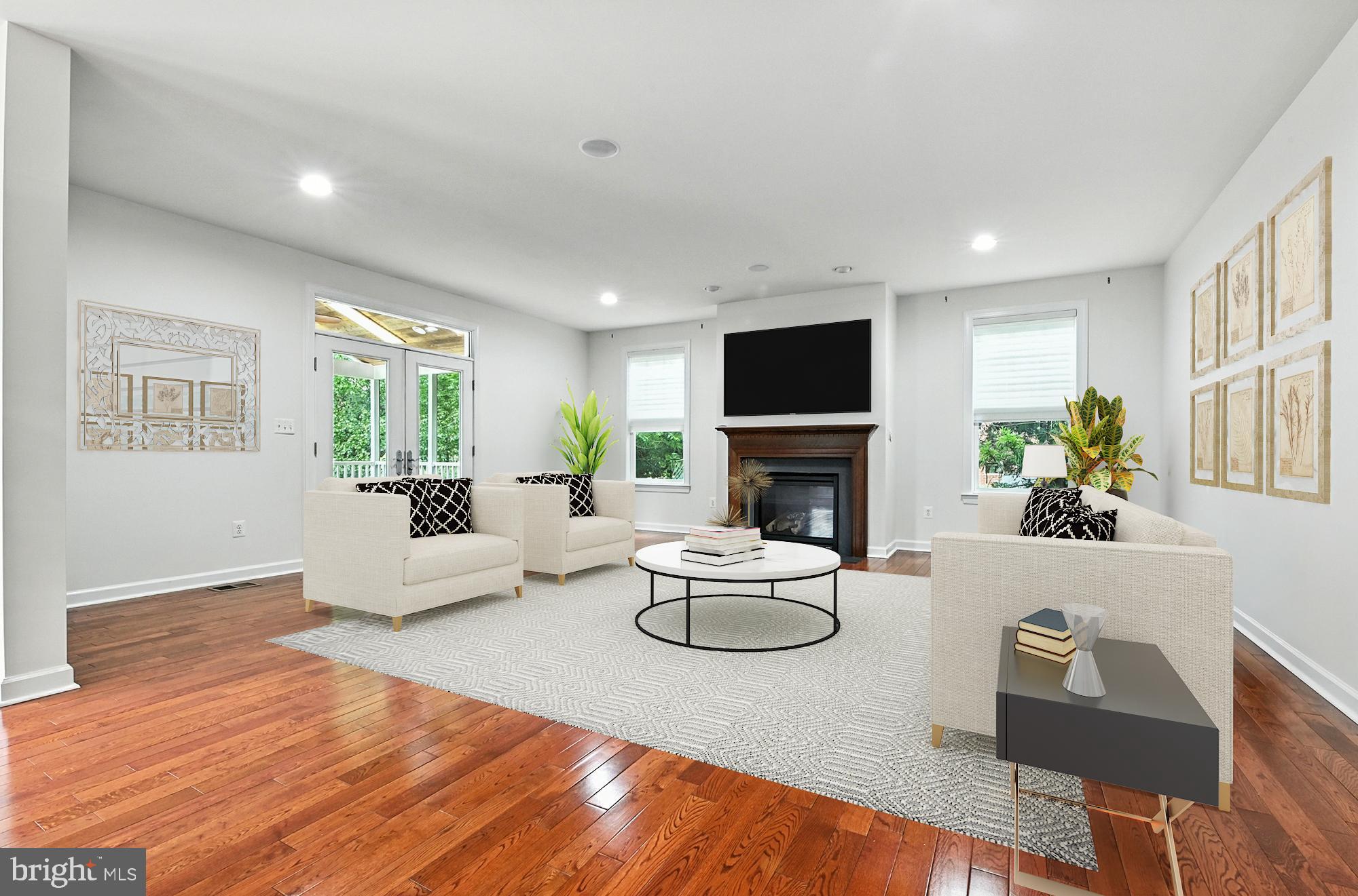 1901 Eamons Way Annapolis, MD 21401 - Photo 6 of 64 a living room with furniture a fireplace and a flat screen tv