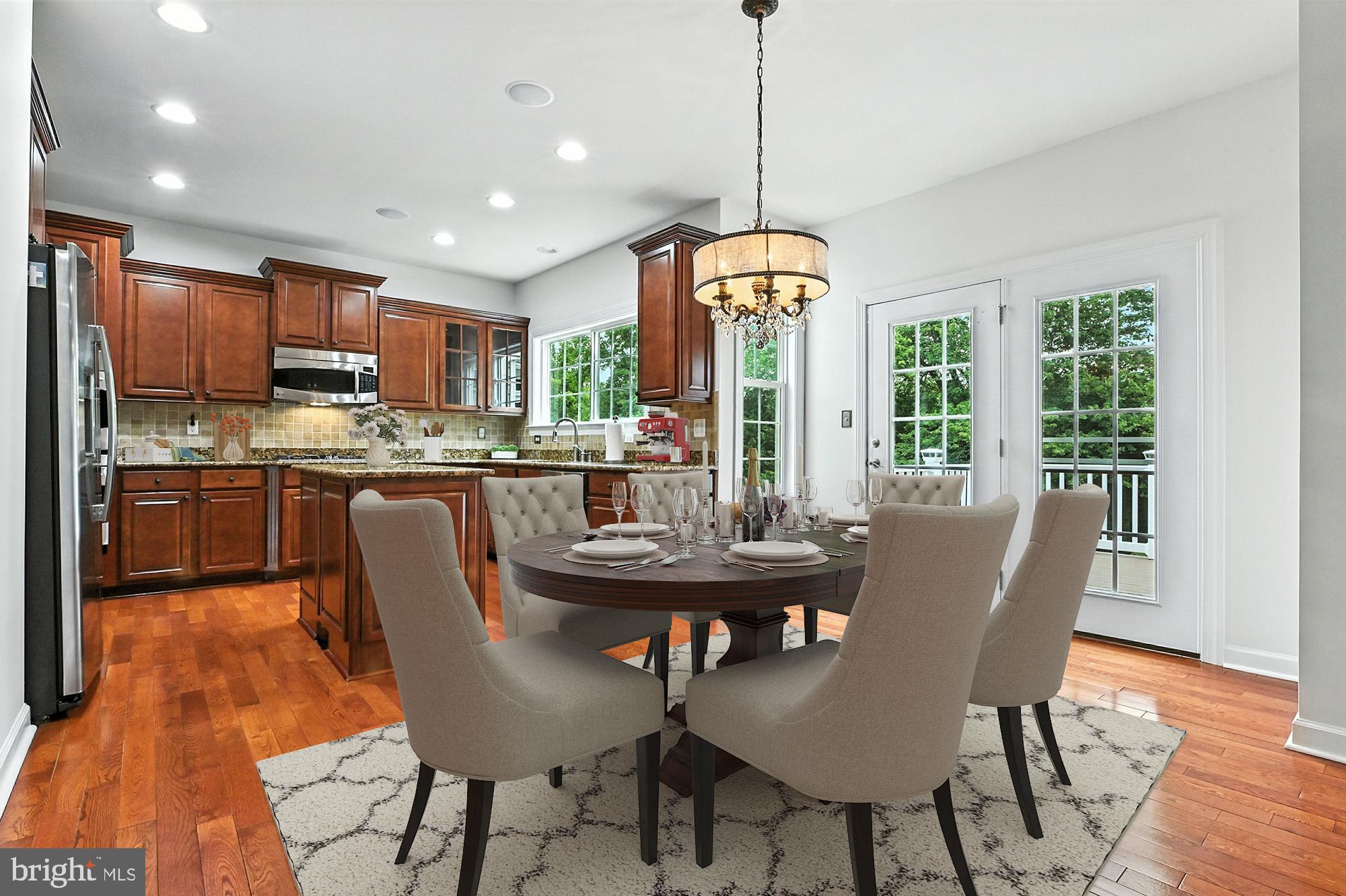 1901 Eamons Way Annapolis, MD 21401 - Photo 7 of 64 a dining room with furniture a chandelier and wooden floor