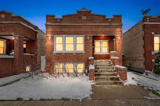 a view of a house with large windows