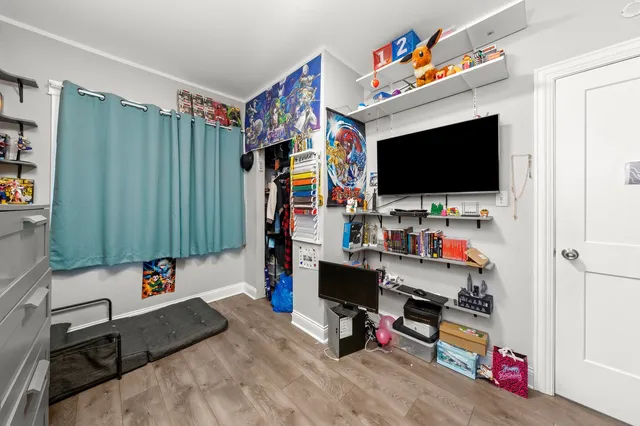 a children room with toys and a flat screen tv