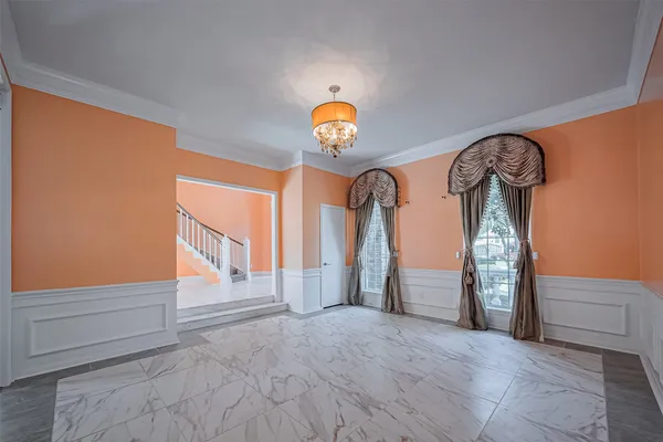 a view of empty room with windows