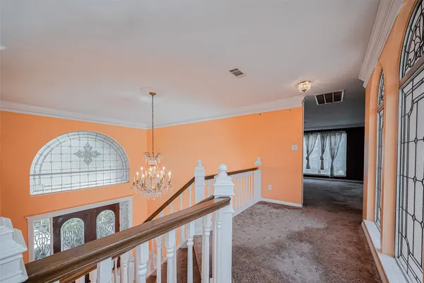 a view of entryway with a front door and wooden floor