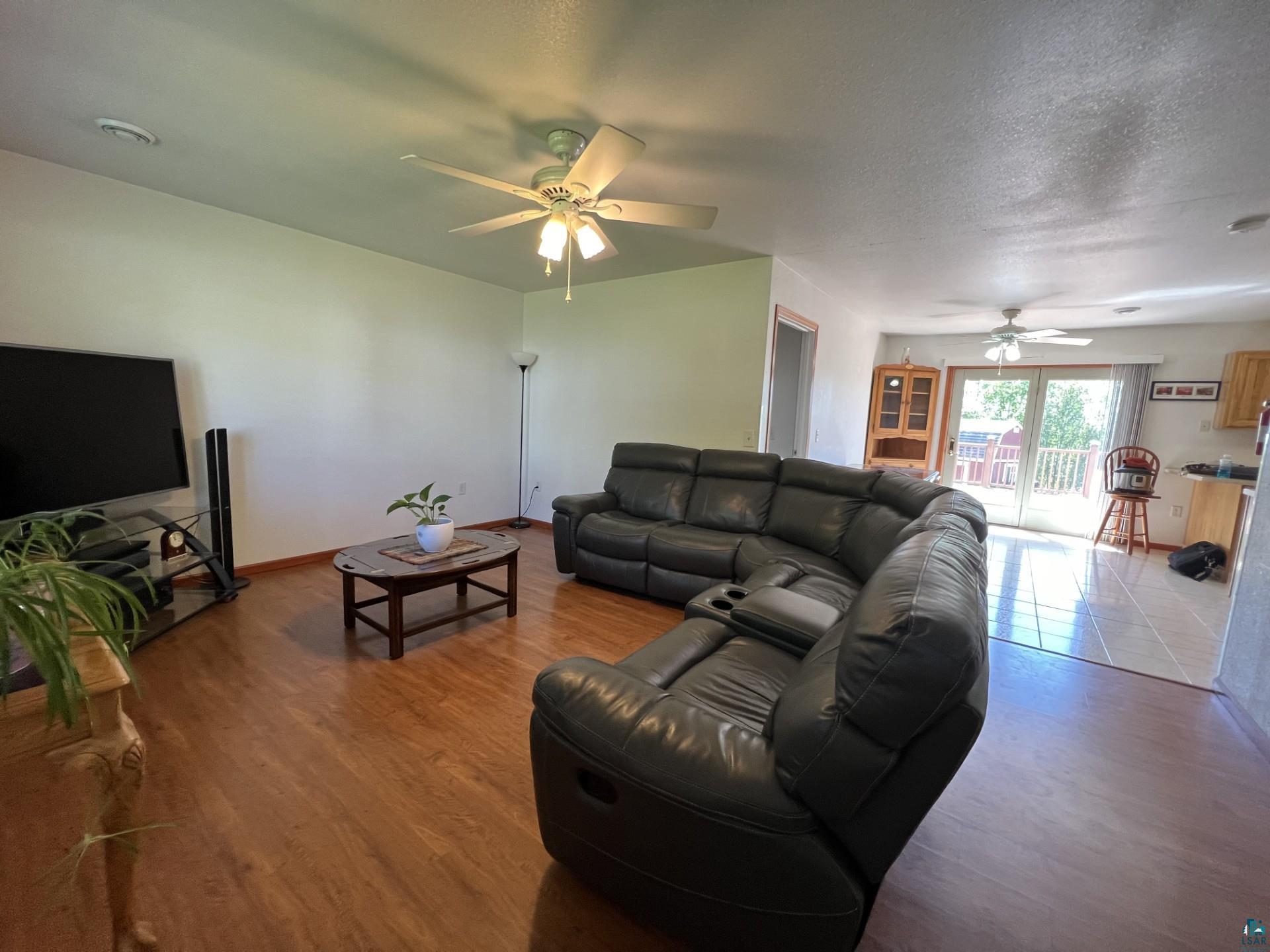 5144 Eagle Lake Road Duluth, MN 55803 - Photo 18 of 47 Living room with hardwood / wood-style floors, ceiling fan, and a textured ceiling