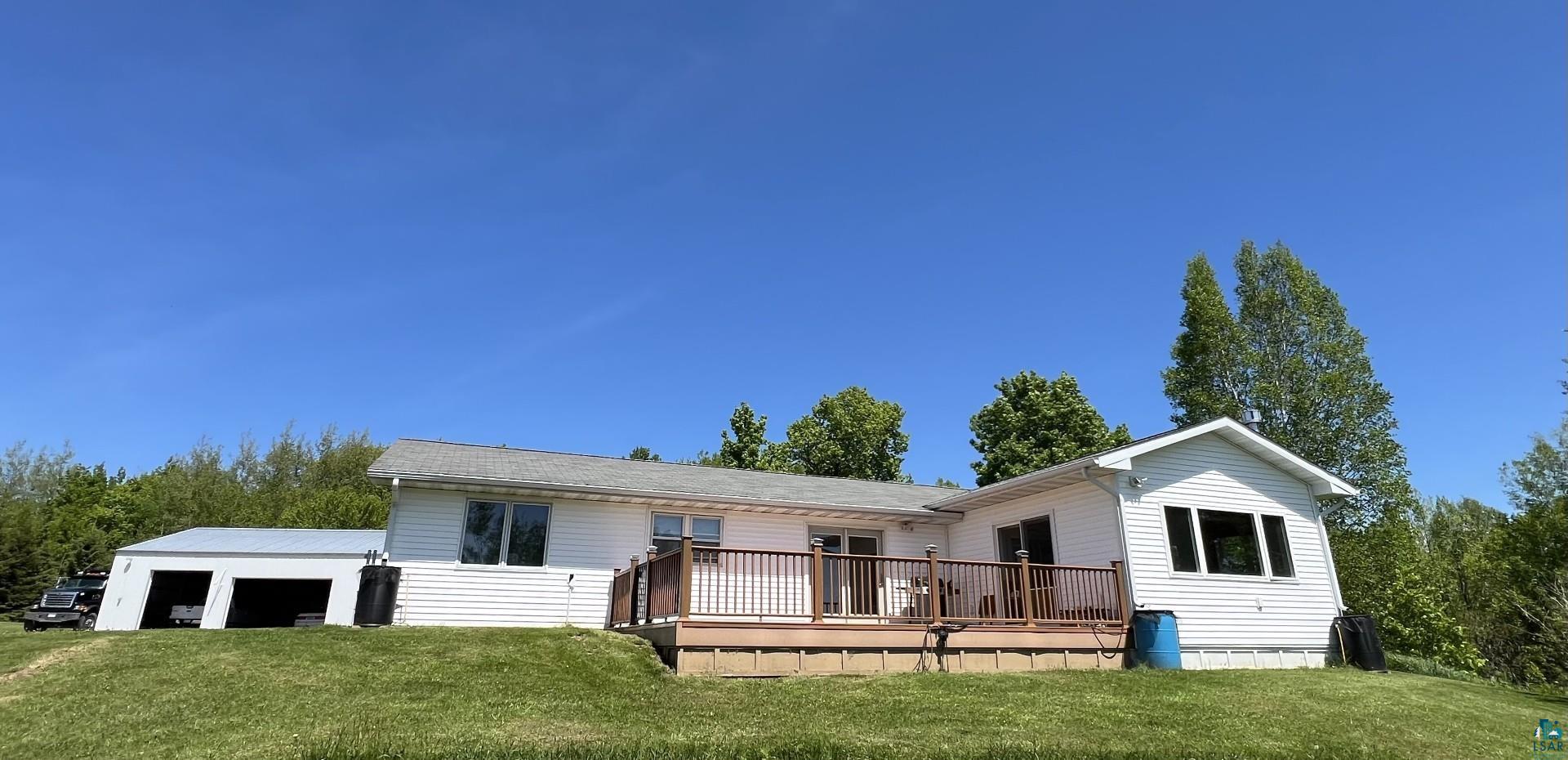 5144 Eagle Lake Road Duluth, MN 55803 - Photo 2 of 47 View of front of home featuring a wooden deck and a front yard