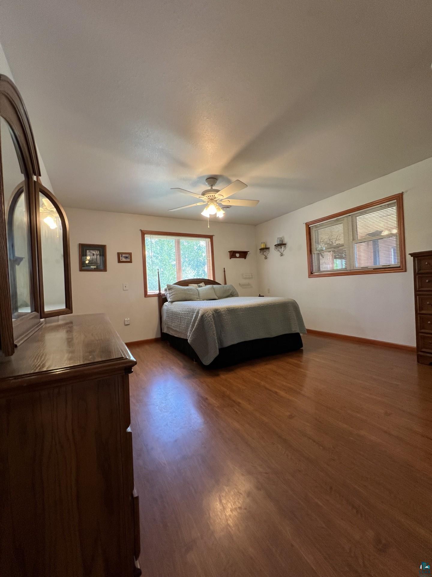 5144 Eagle Lake Road Duluth, MN 55803 - Photo 21 of 47 Unfurnished bedroom with dark hardwood / wood-style floors and ceiling fan