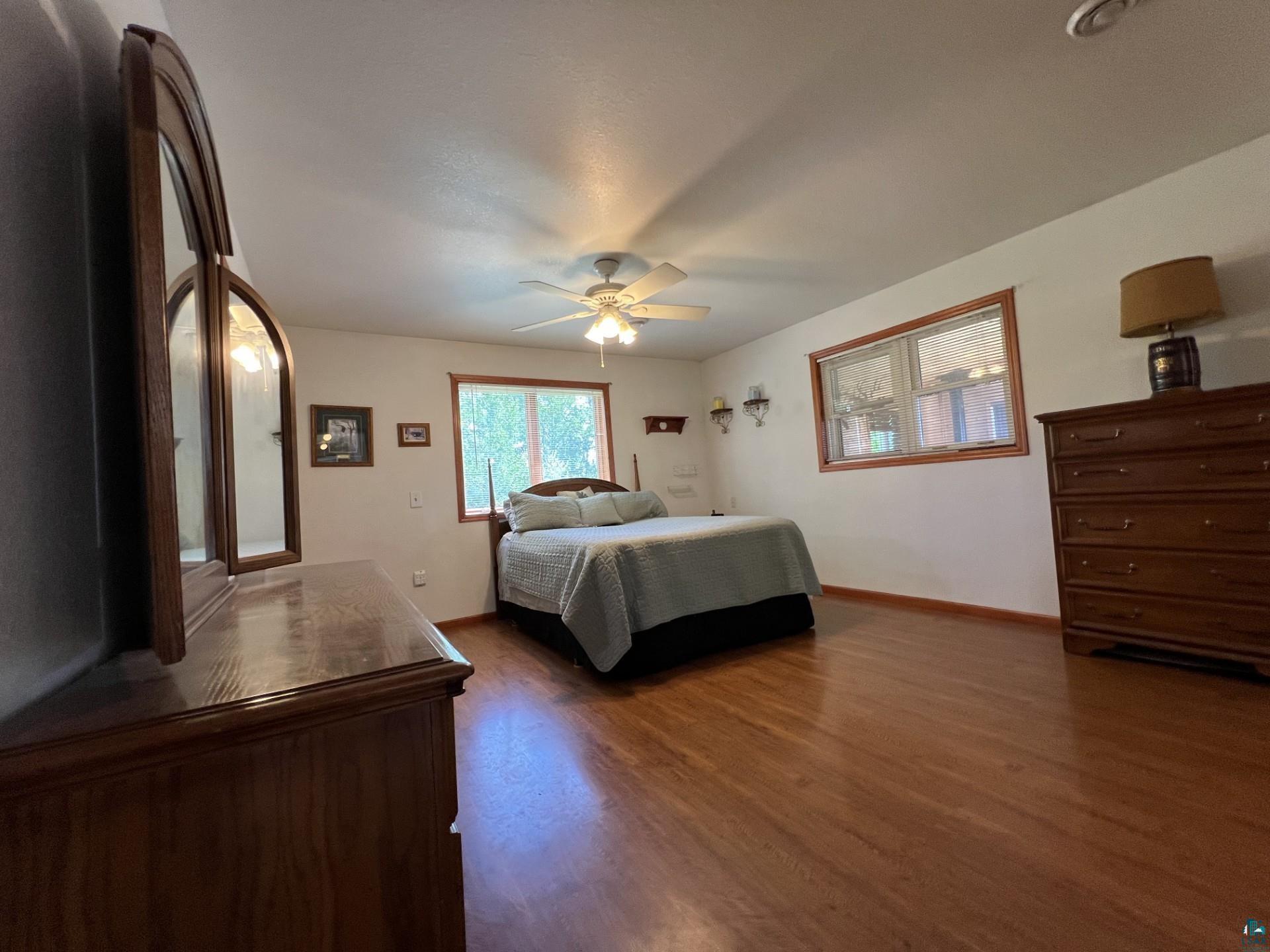 5144 Eagle Lake Road Duluth, MN 55803 - Photo 22 of 47 Bedroom featuring ceiling fan and dark hardwood / wood-style floors