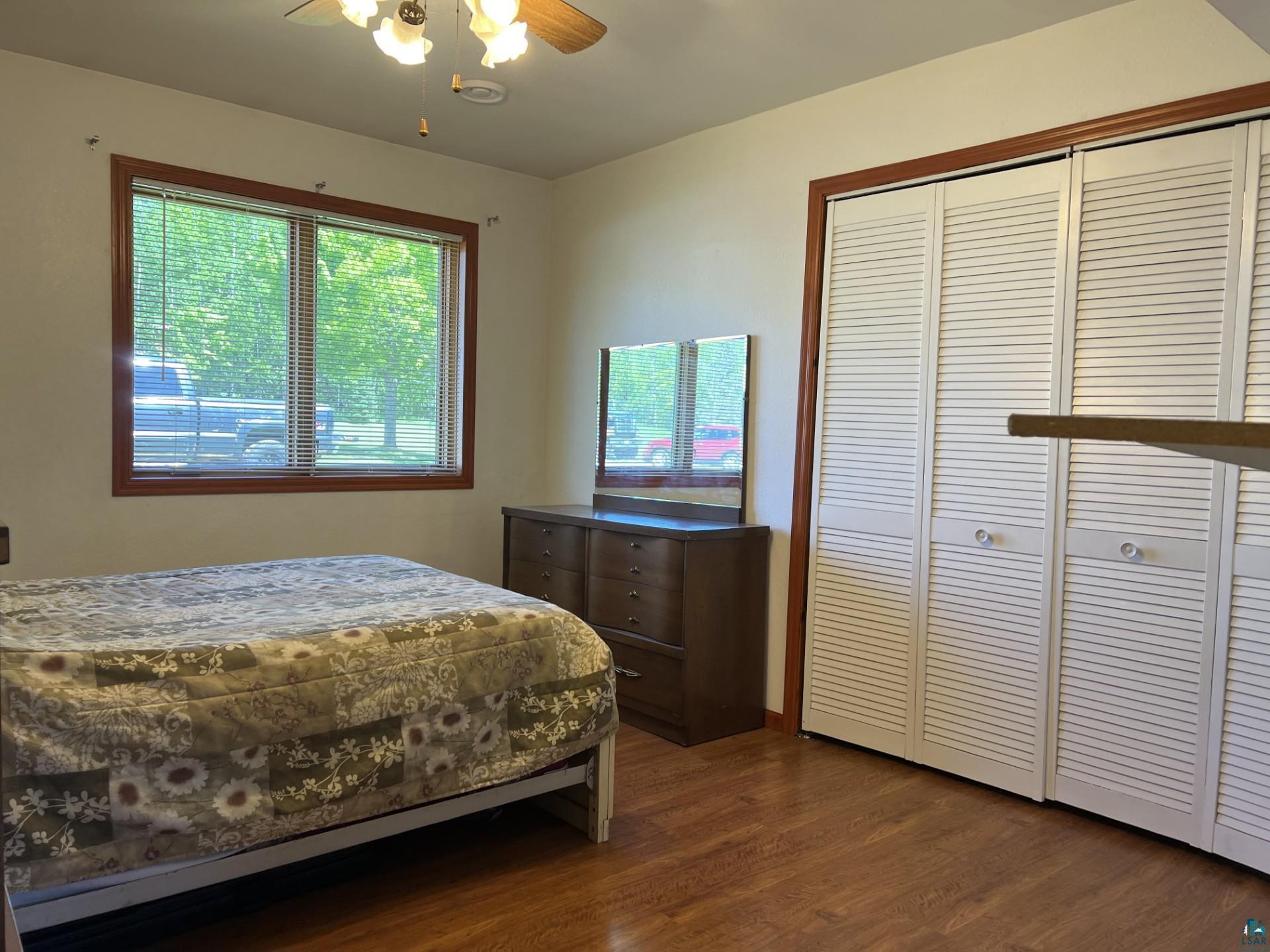 5144 Eagle Lake Road Duluth, MN 55803 - Photo 27 of 47 Bedroom with a closet, ceiling fan, and hardwood / wood-style floors