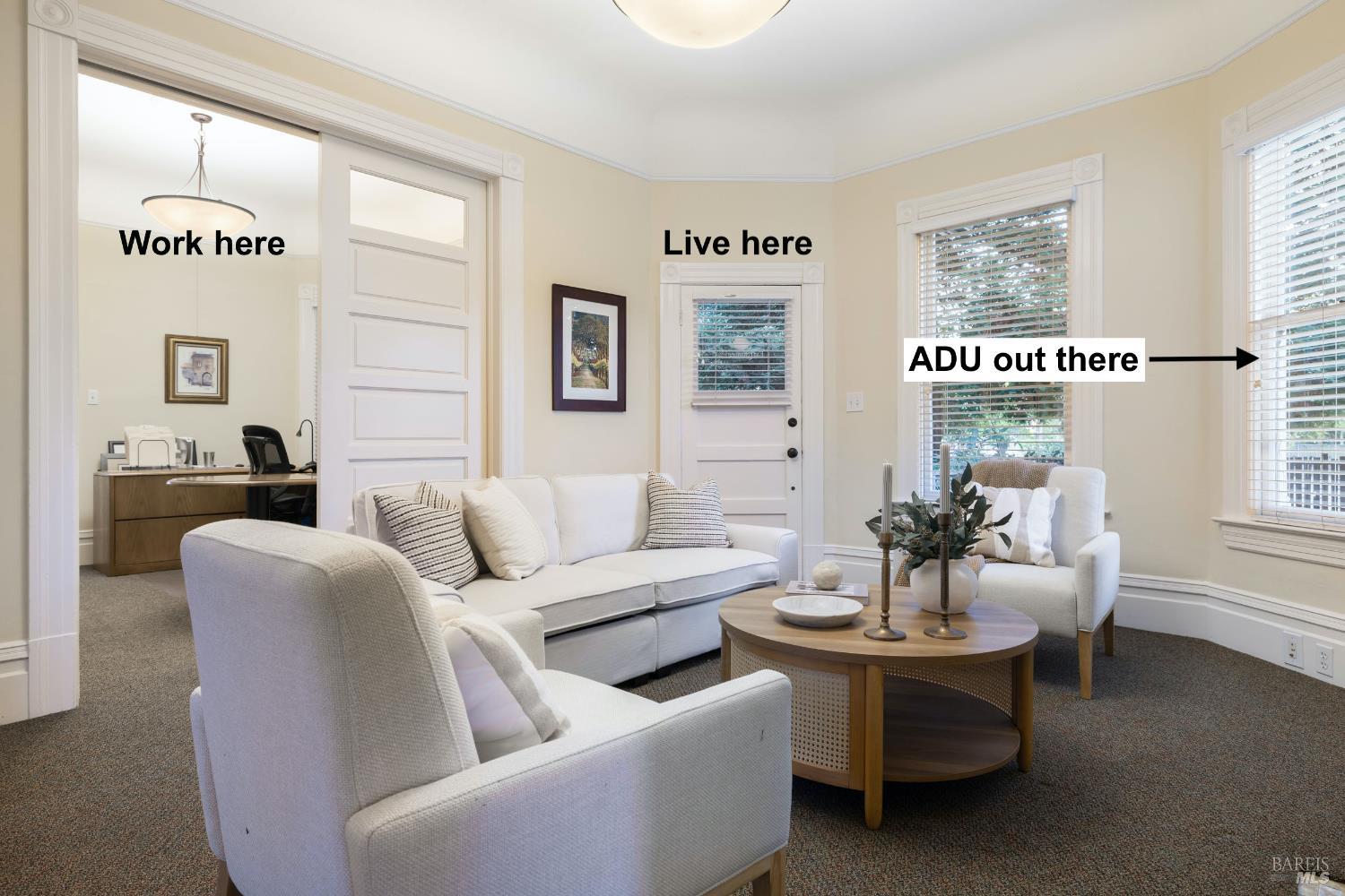 a living room with furniture and a window