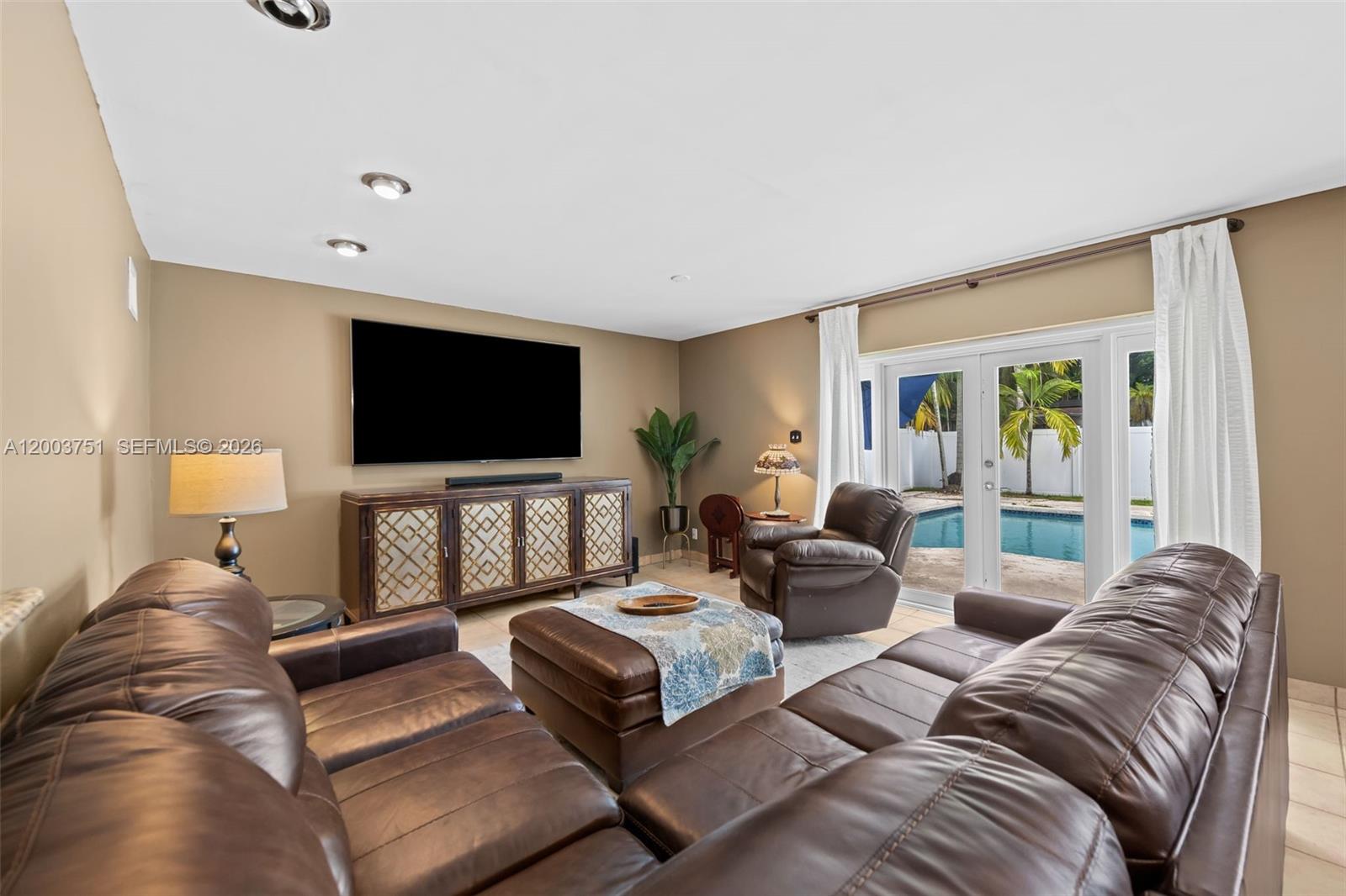1925 North 39th Avenue Hollywood, FL 33021 - Photo 11 of 20 a living room with furniture and a flat screen tv