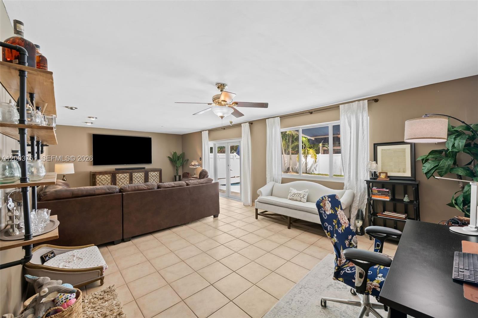 1925 North 39th Avenue Hollywood, FL 33021 - Photo 13 of 20 a living room with furniture and a flat screen tv