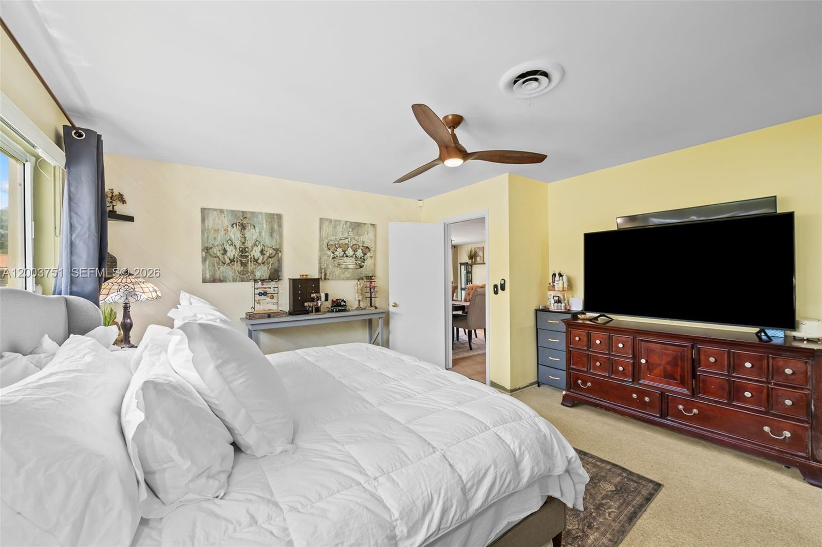 1925 North 39th Avenue Hollywood, FL 33021 - Photo 16 of 20 a bedroom with a bed and a flat screen tv