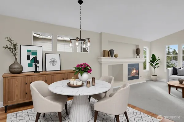 a view of a dining room with furniture and wooden floor