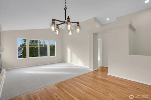a view of a livingroom with a ceiling fan and window