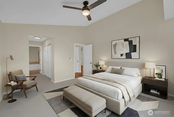 a bedroom with a bed and chair