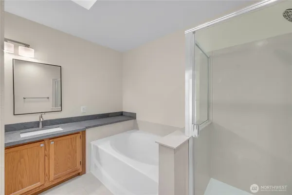 a bathroom with a bathtub and a sink