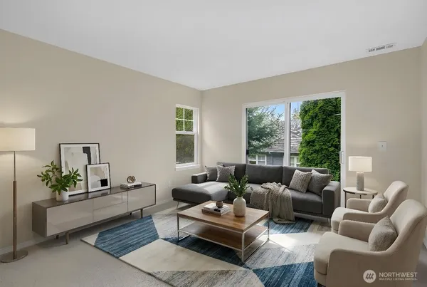 a living room with furniture and a large window