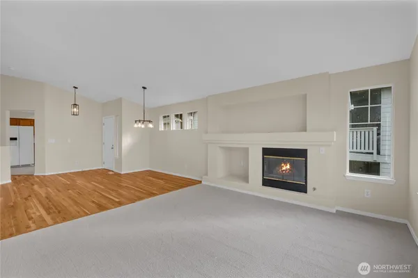a view of empty room with a fireplace
