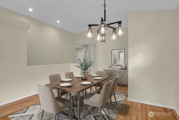 a view of a dining room with furniture and wooden floor