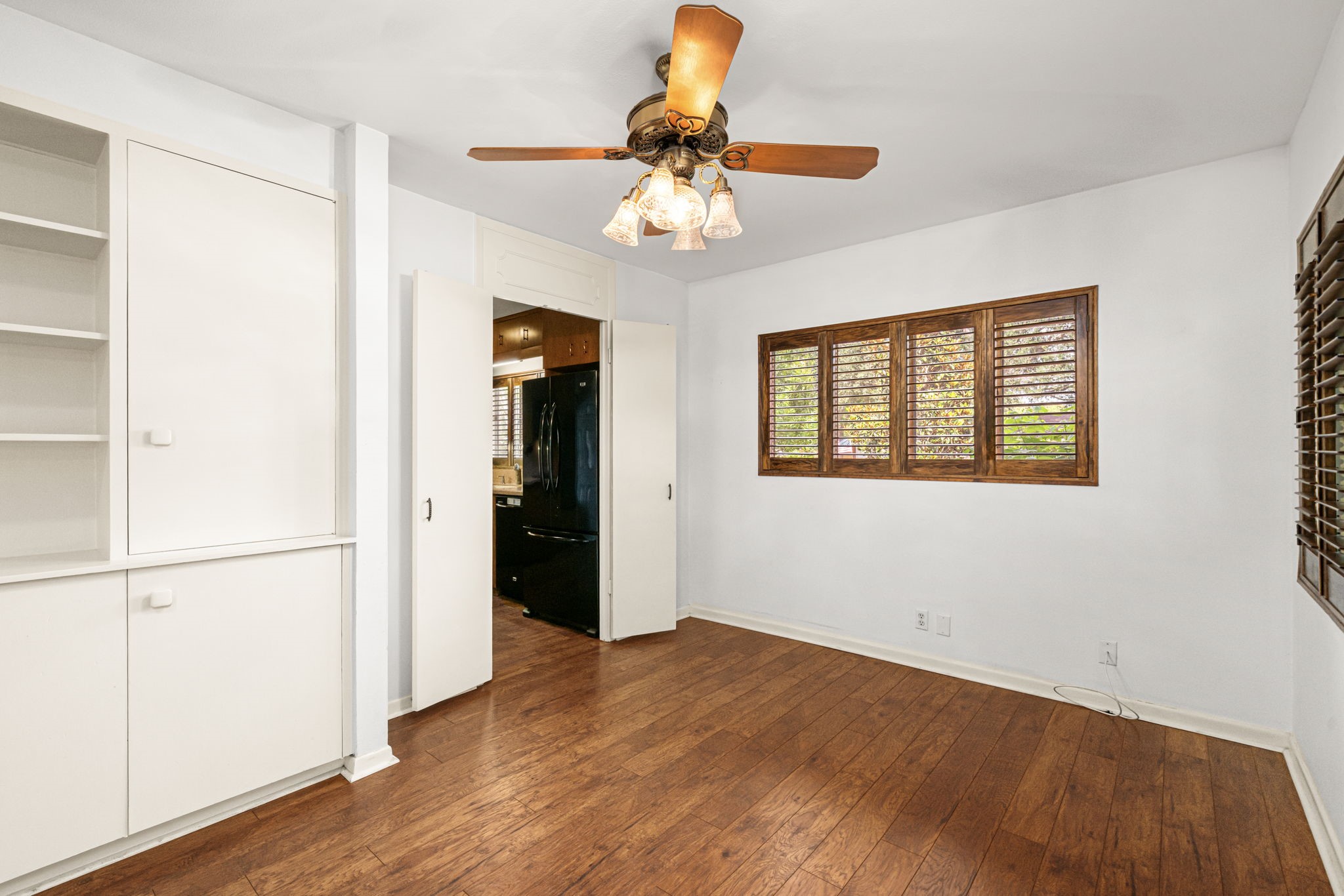 1908 Milam Street Columbus, TX 78934 - Photo 11 of 39 a view of an empty room with wooden floor