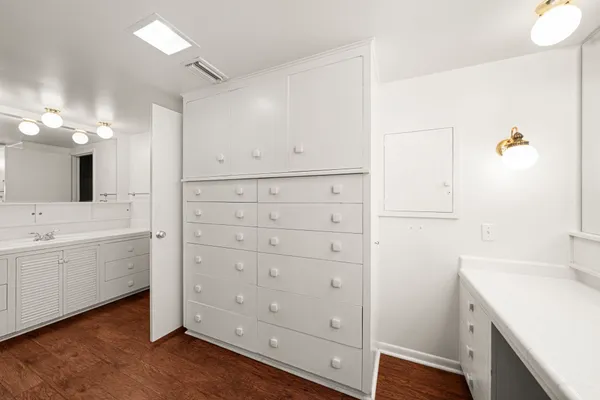 a bathroom with a sink a shower and a mirror