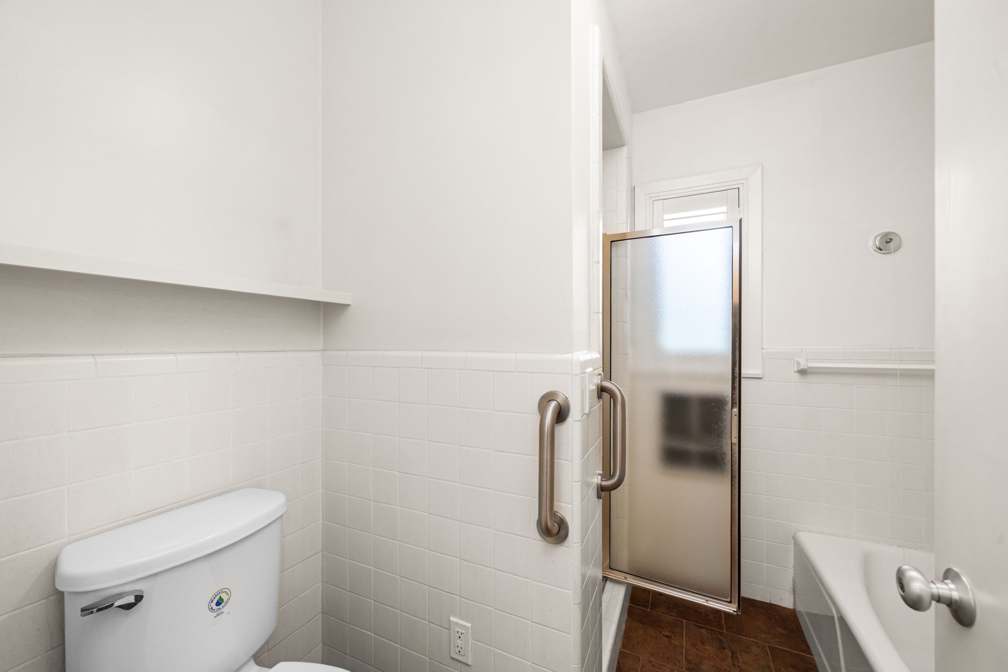 1908 Milam Street Columbus, TX 78934 - Photo 21 of 39 a bathroom with a shower and toilet