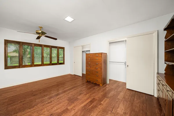 a kitchen with stainless steel appliances granite countertop a stove a refrigerator and a white cabinets