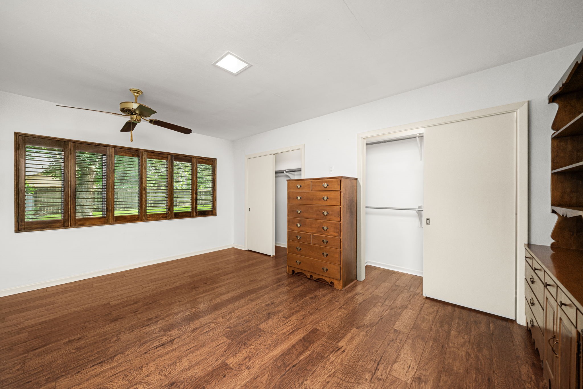 1908 Milam Street Columbus, TX 78934 - Photo 28 of 39 a view of an empty room with a window and wooden floor