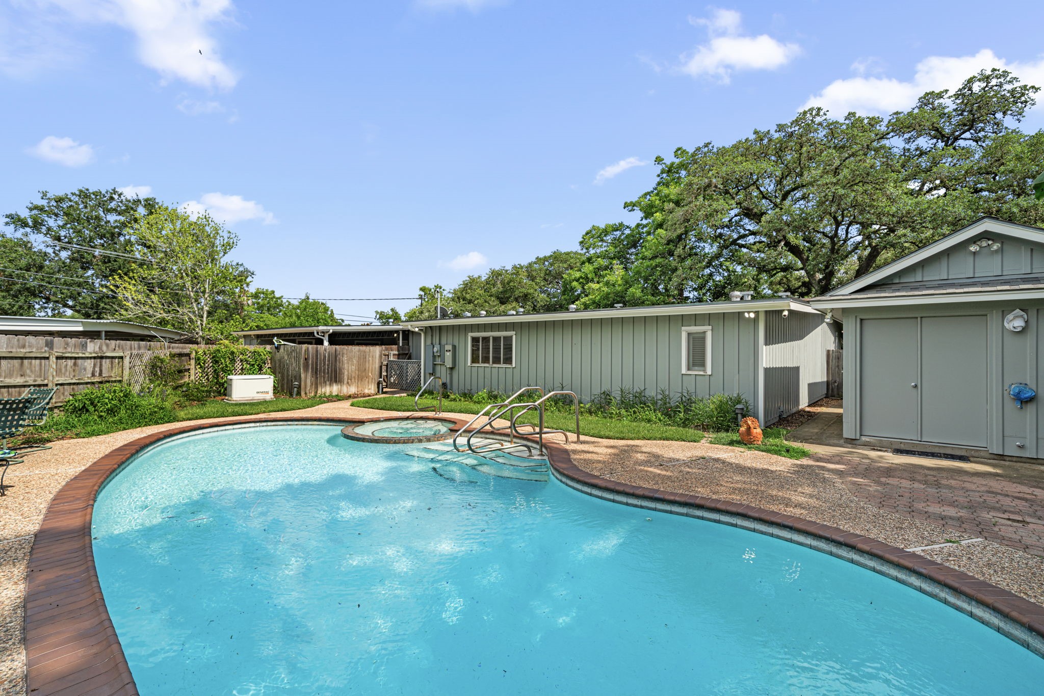 1908 Milam Street Columbus, TX 78934 - Photo 34 of 39 a view of a house with swimming pool and sitting area