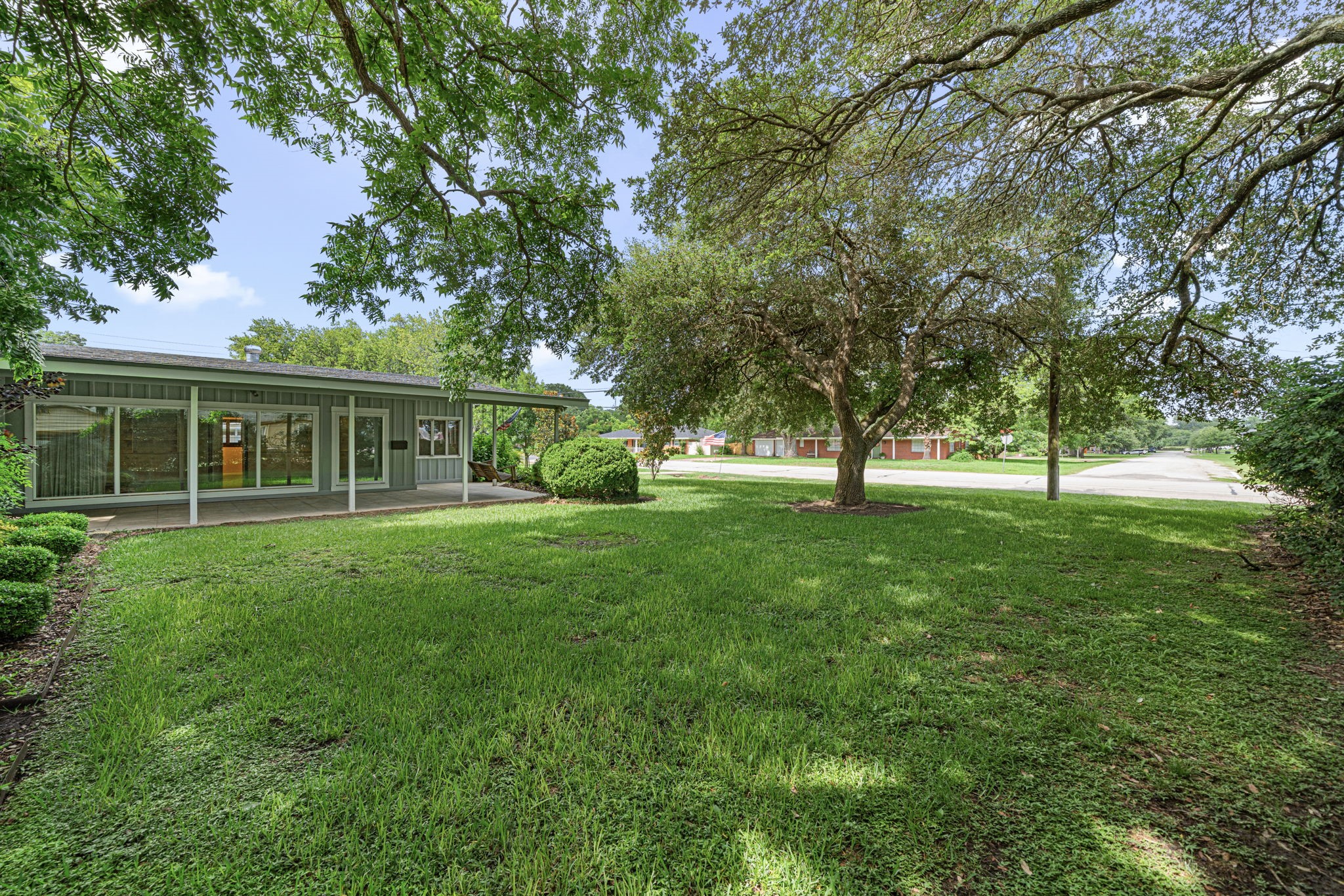 1908 Milam Street Columbus, TX 78934 - Photo 5 of 39 a view of an house with backyard space and garden