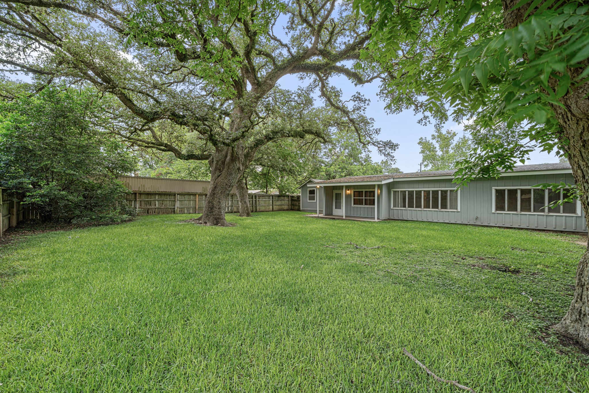 1908 Milam Street Columbus, TX 78934 - Photo 6 of 39 a front view of a house with a garden