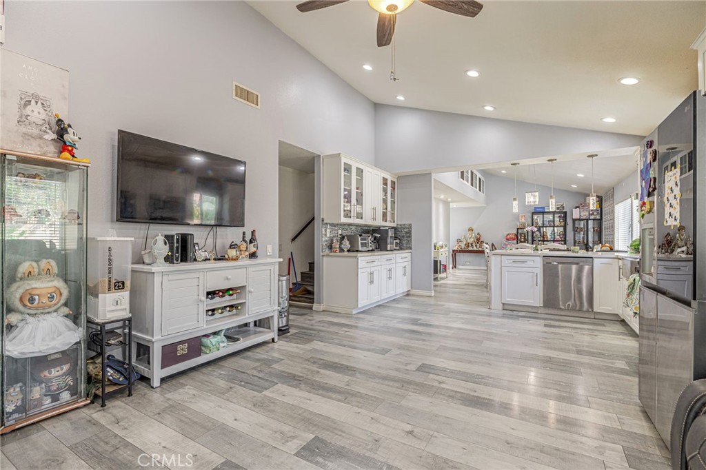 2078 Swindon Avenue Simi Valley, CA 93063 - Photo 13 of 44 a large white kitchen with kitchen island a sink stainless steel appliances and cabinets