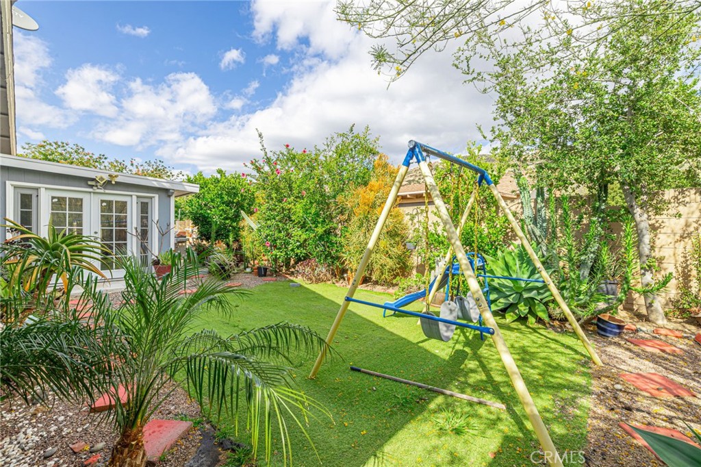 2078 Swindon Avenue Simi Valley, CA 93063 - Photo 30 of 44 a backyard of a house with a yard and potted plants