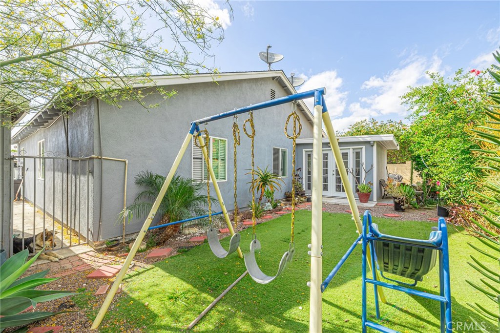2078 Swindon Avenue Simi Valley, CA 93063 - Photo 31 of 44 a view of a house with a backyard and a patio