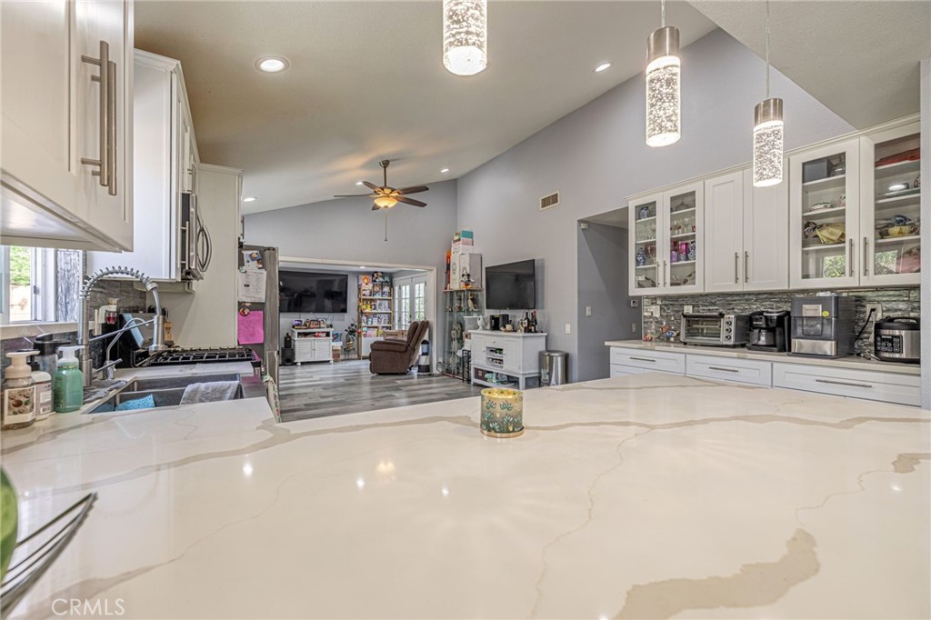 2078 Swindon Avenue Simi Valley, CA 93063 - Photo 10 of 44 a view of a living room kitchen and a sink