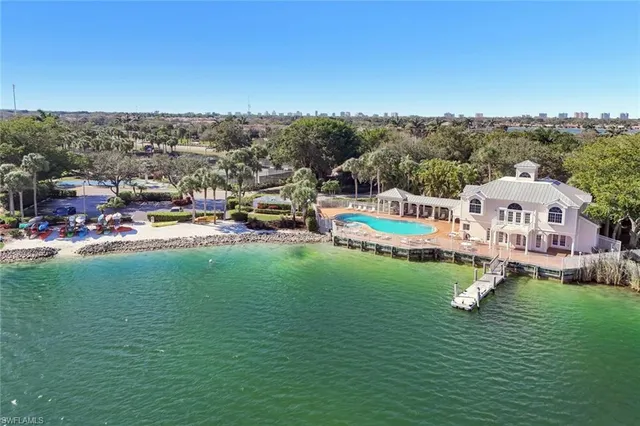 a view of a house with a garden and houses