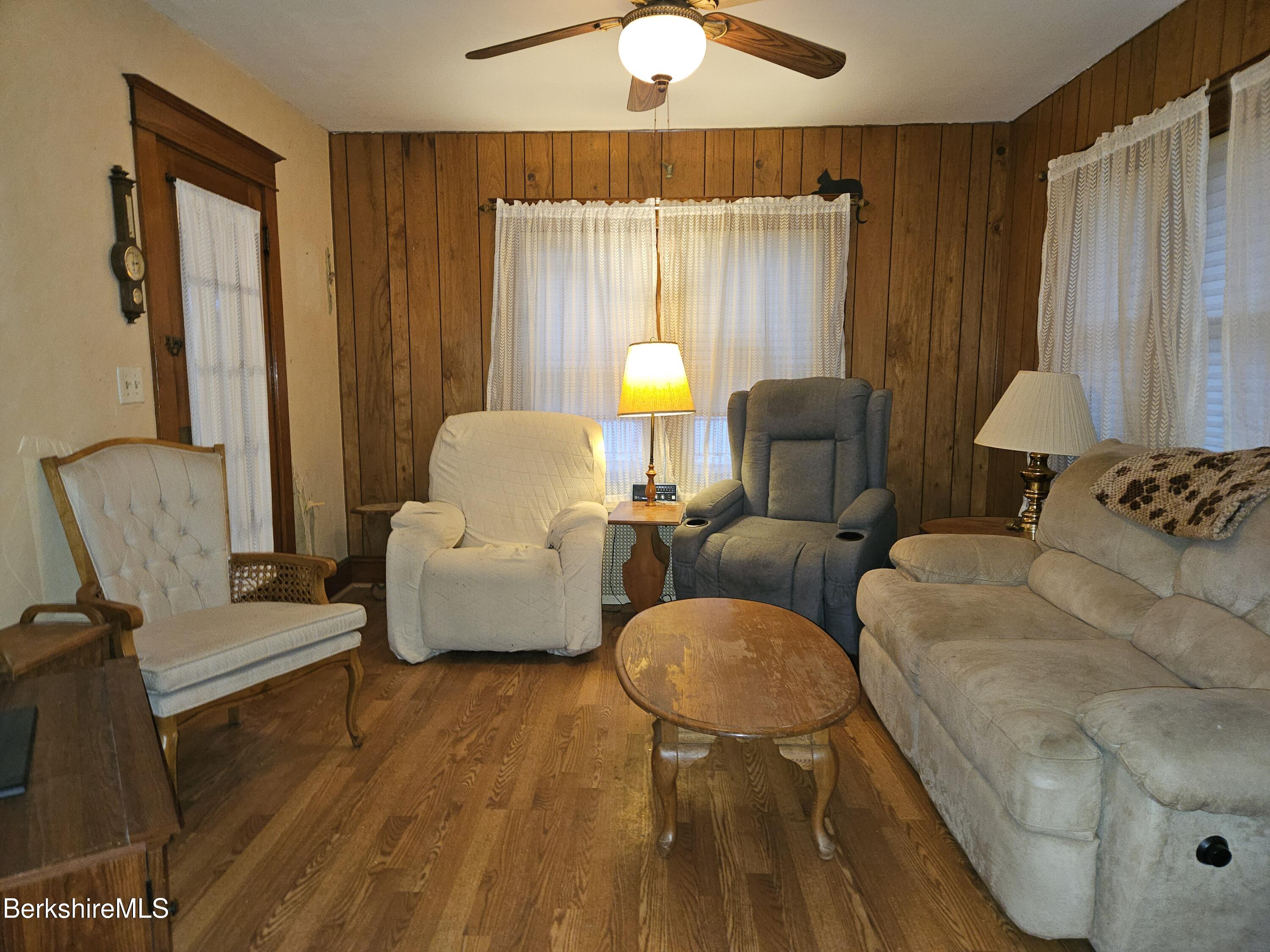 269 2nd Street Pittsfield, MA 01201 - Photo 6 of 39 a living room with furniture and a chandelier