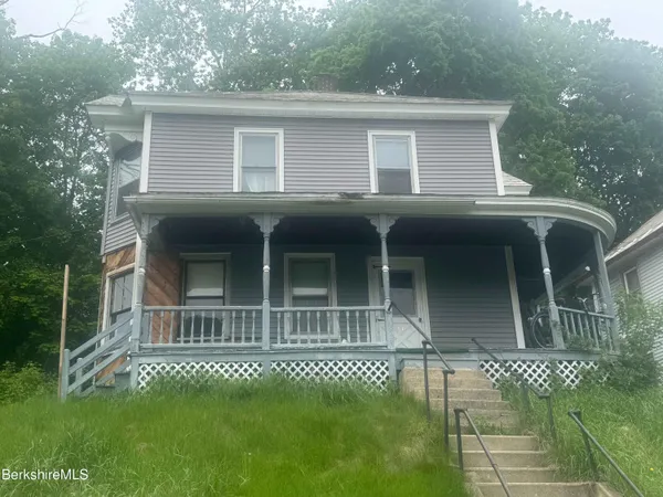 a house view with a garden space