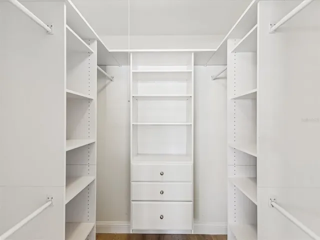 a view of an empty walk in closet