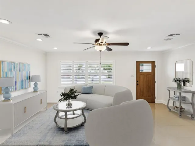 a living room with furniture and white walls