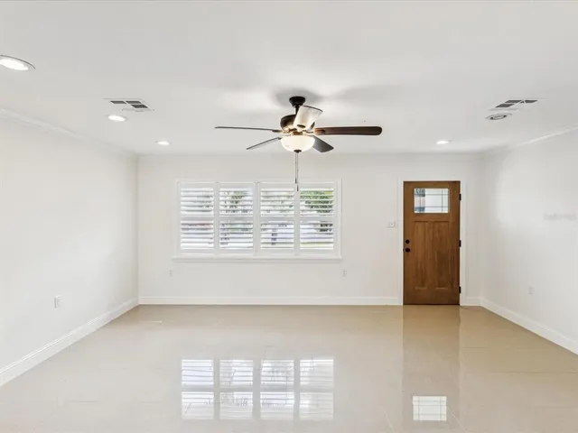 a view of an empty room with a window