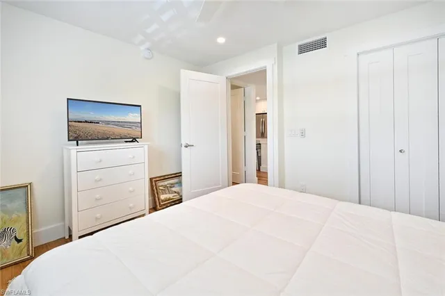 a bedroom with a bed and a dresser