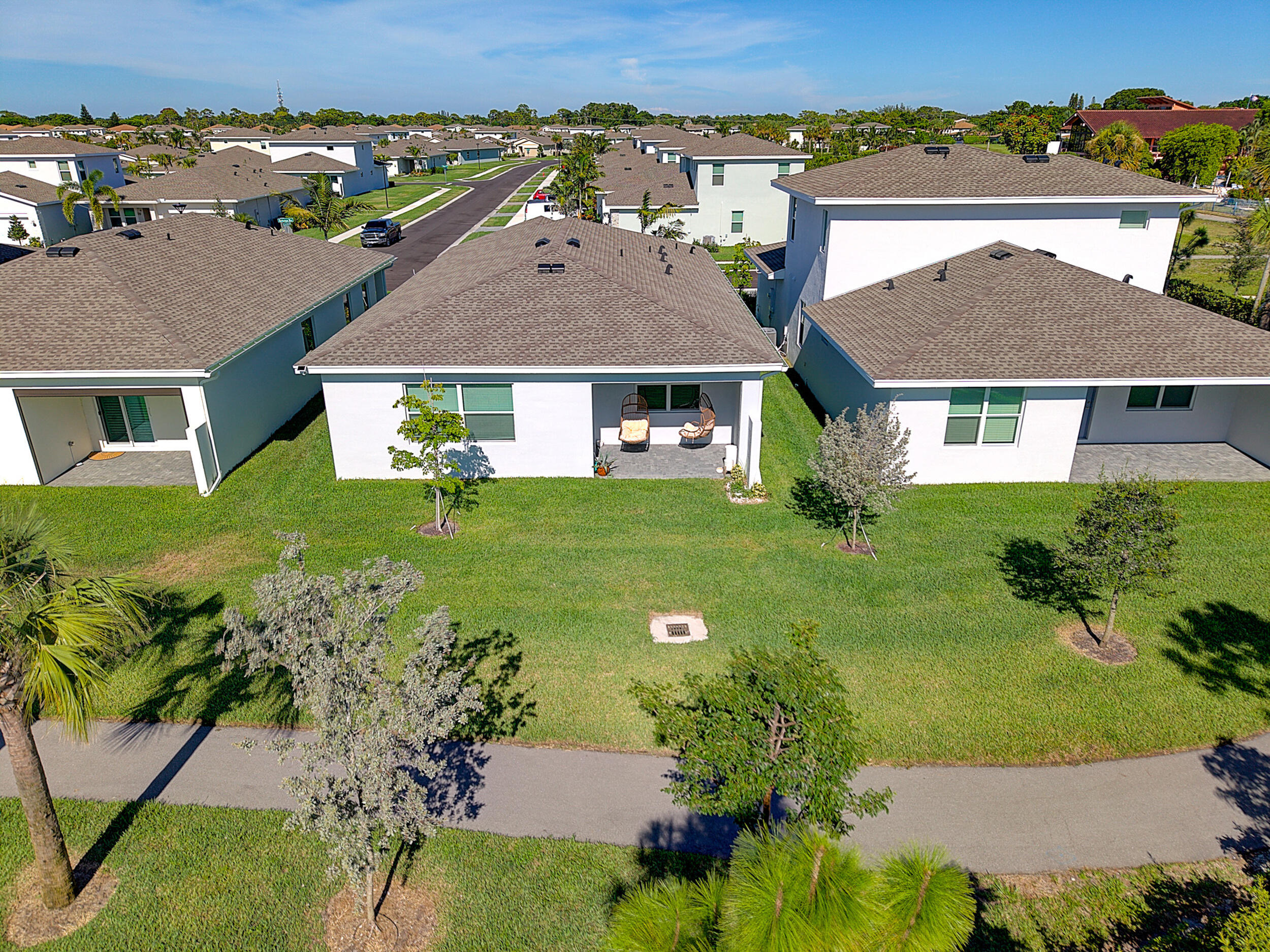 13421 Brotherhood Way Delray Beach, FL 33484 - Photo 11 of 16 front view of a house with a yard