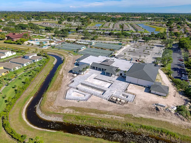 an aerial view of a house with a ocean view