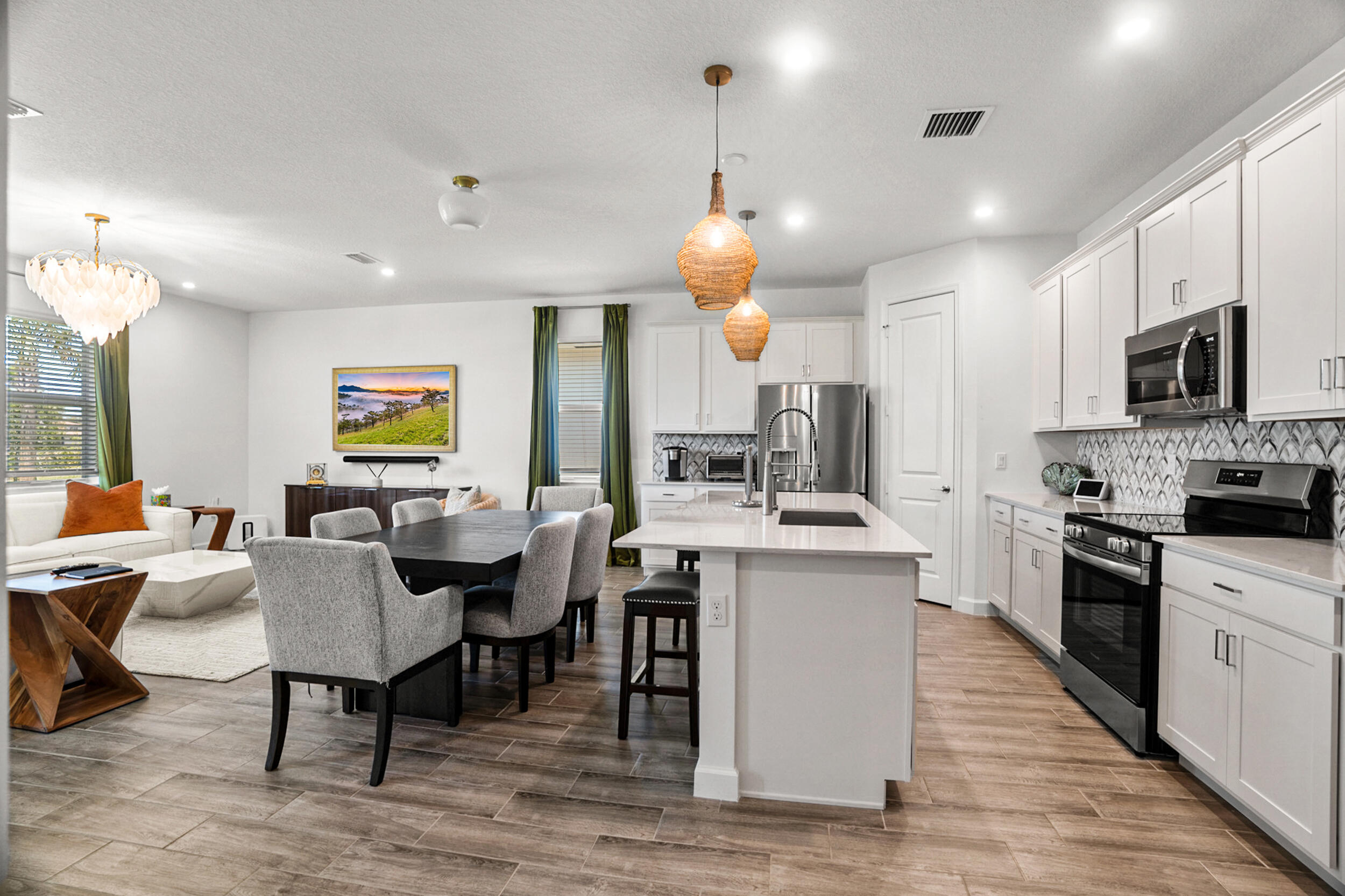 13421 Brotherhood Way Delray Beach, FL 33484 - Photo 5 of 16 a large kitchen with a table and chairs