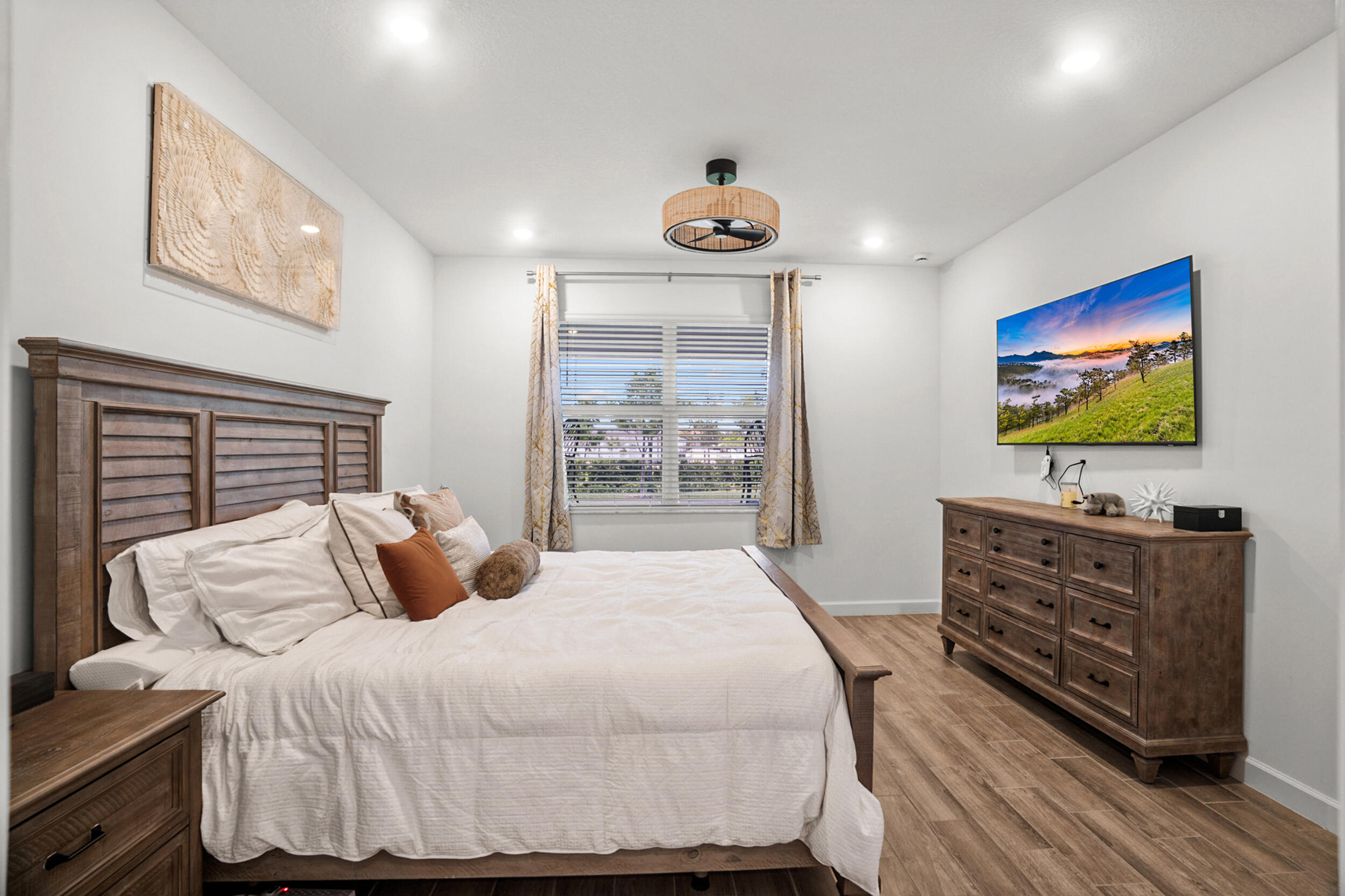 13421 Brotherhood Way Delray Beach, FL 33484 - Photo 7 of 16 a bedroom with a bed and a flat screen tv