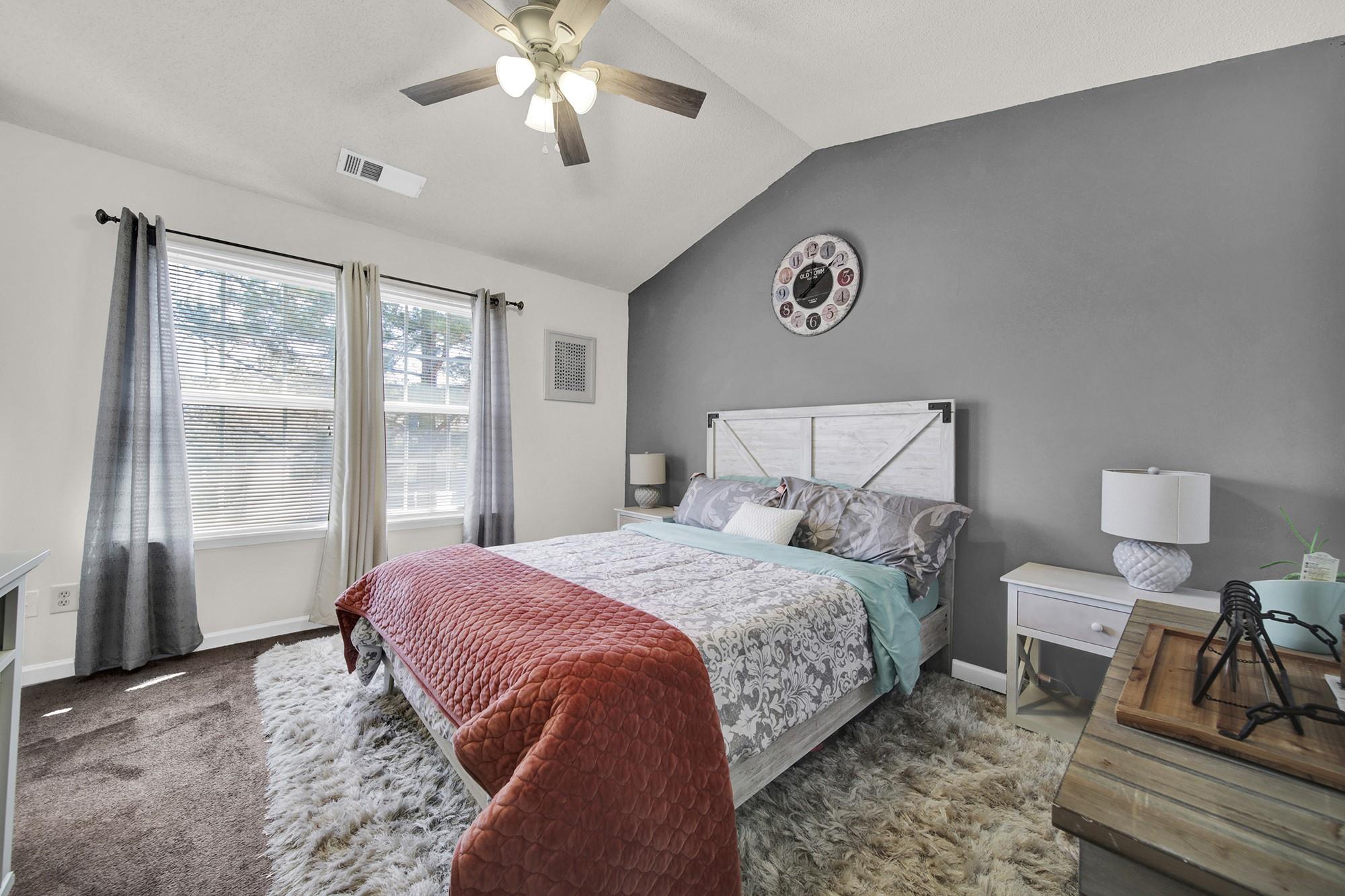 11223 Grass Field Road Charlotte, NC 28213 - Photo 11 of 25 a bedroom with a bed and glass window
