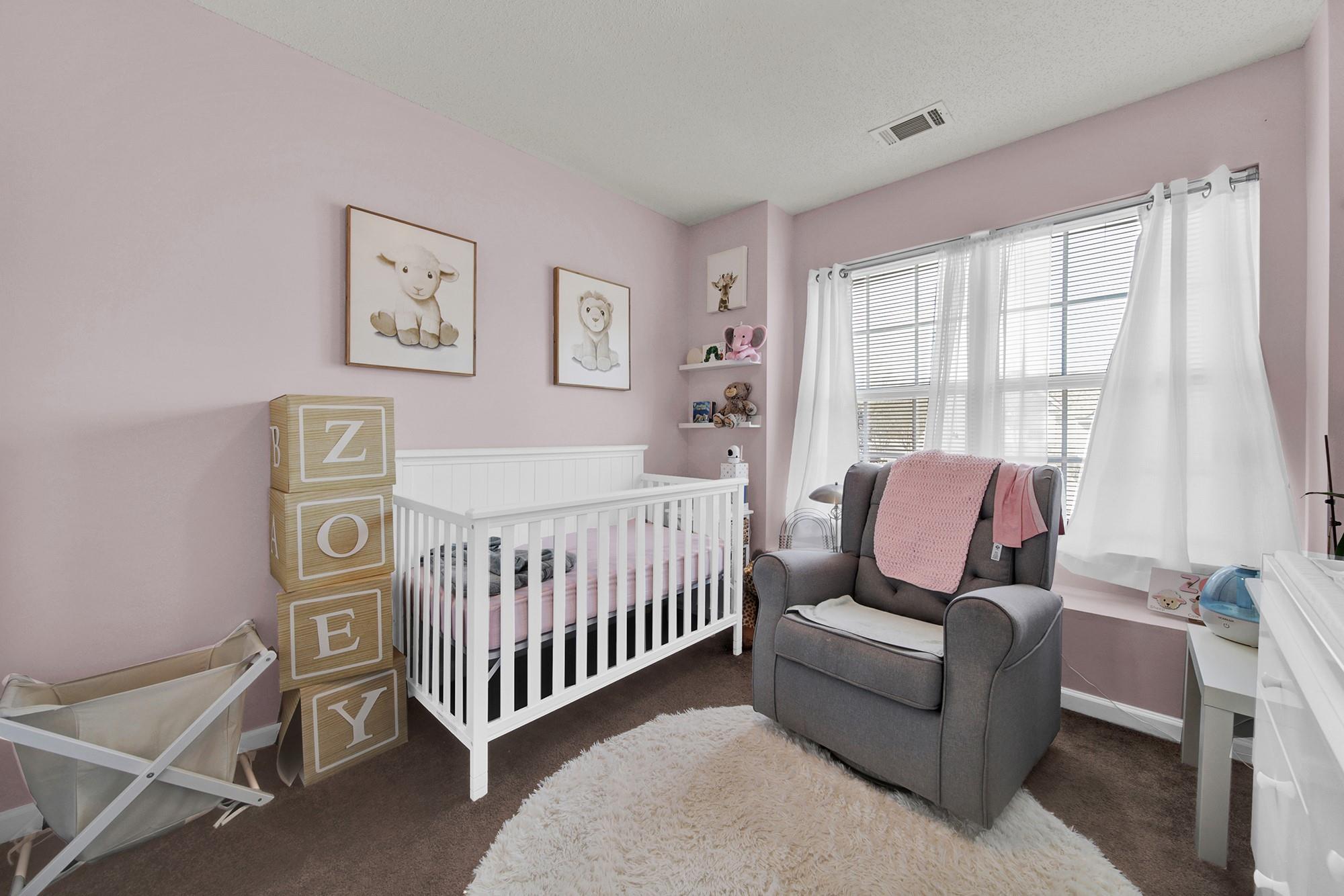 11223 Grass Field Road Charlotte, NC 28213 - Photo 13 of 25 a bedroom with a bed and window