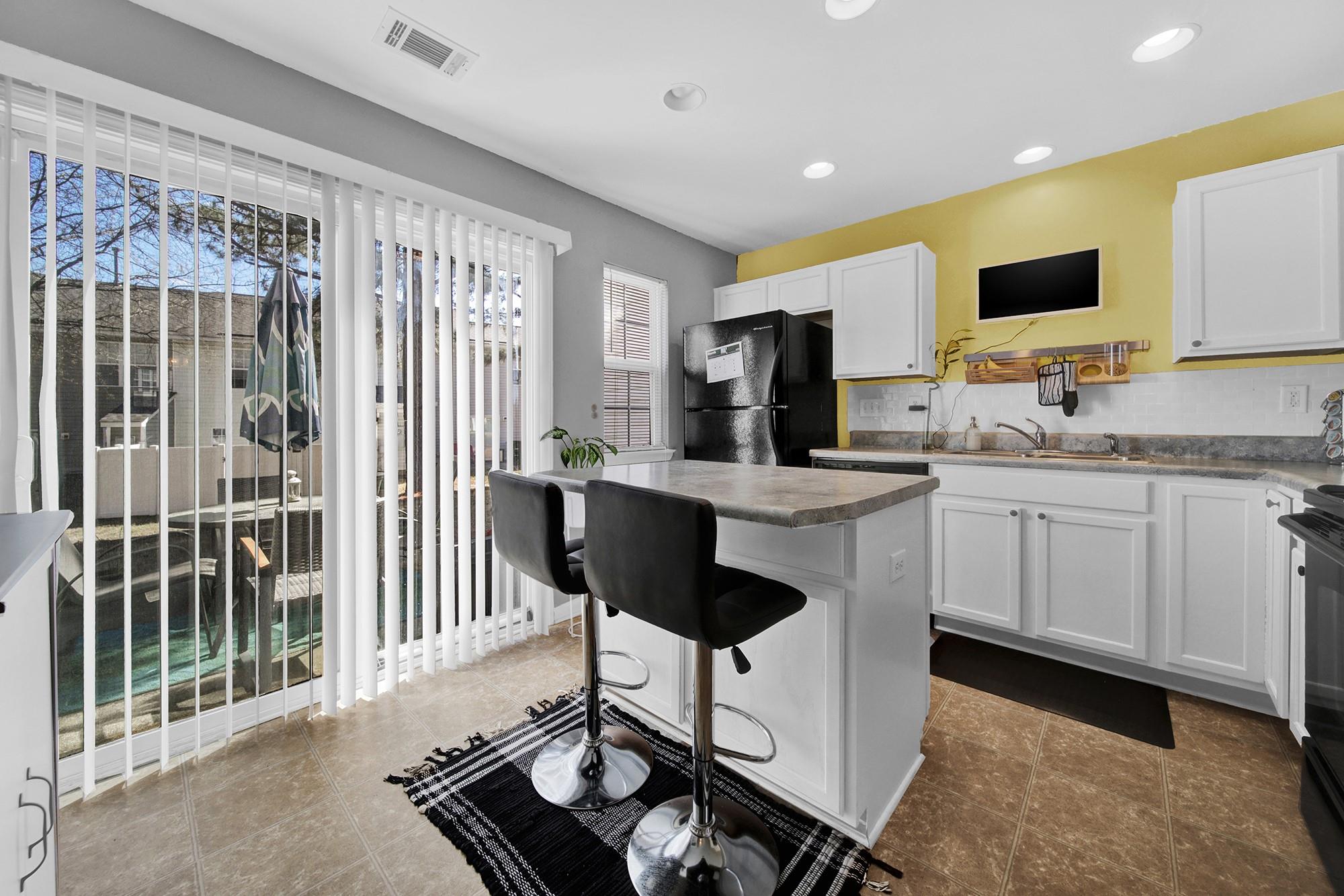 11223 Grass Field Road Charlotte, NC 28213 - Photo 20 of 25 a kitchen with a sink stove and cabinets