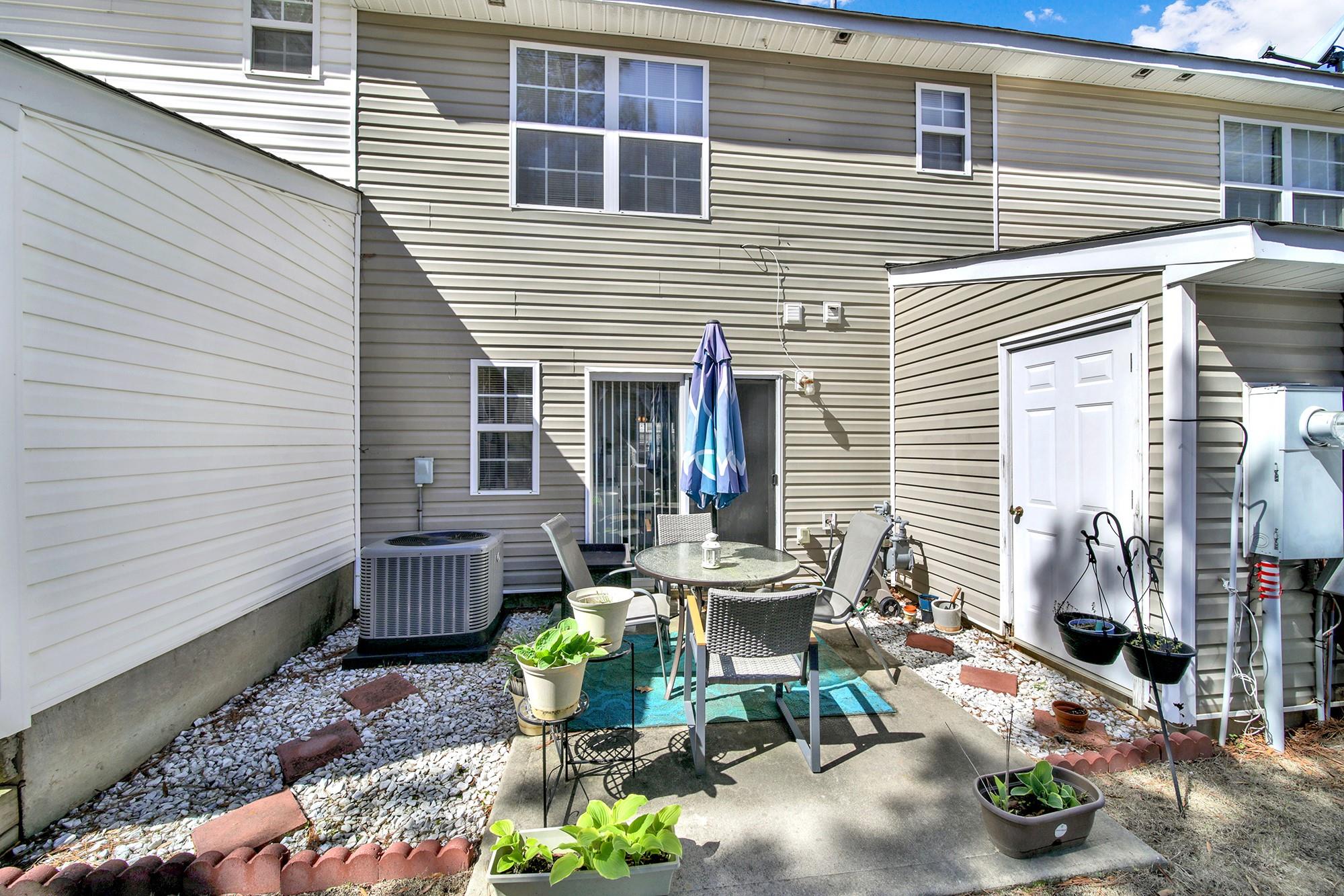 11223 Grass Field Road Charlotte, NC 28213 - Photo 22 of 25 a view of a patio with couple of chairs