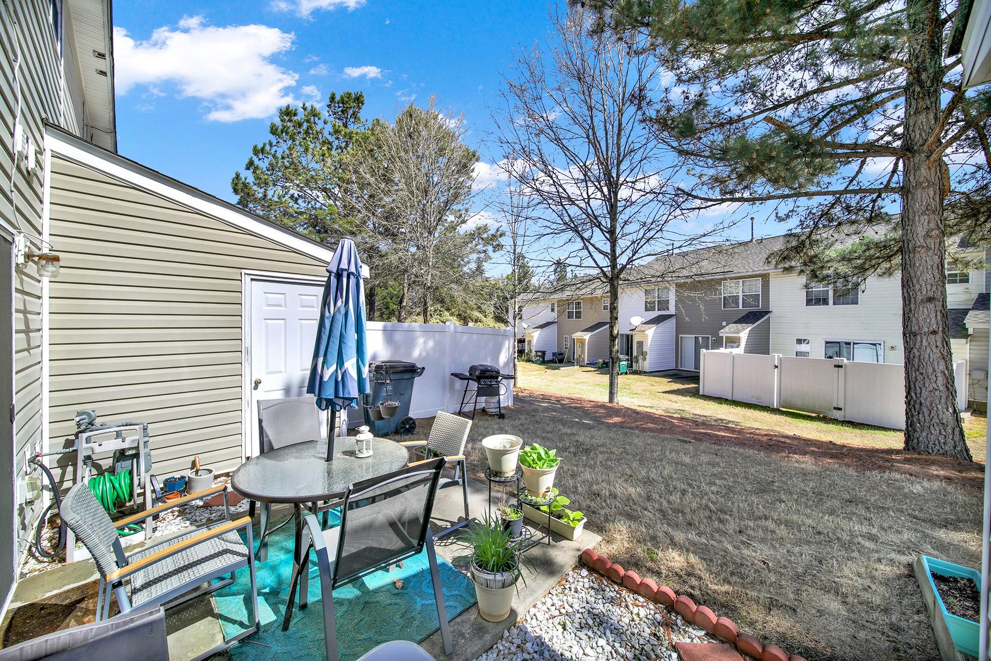 11223 Grass Field Road Charlotte, NC 28213 - Photo 23 of 25 a view of a backyard with sitting area